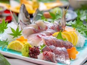 a plate of food with different types of seafood at Yufuin Yasuha in Yufu