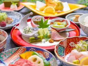 a bunch of plates of food on a table at Yufuin Yasuha in Yufu