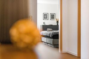 a room with a bed and a mirror at Fewo Stembers in Heideck