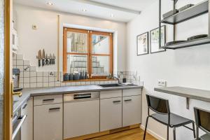a kitchen with a sink and a window at Fewo Stembers in Heideck