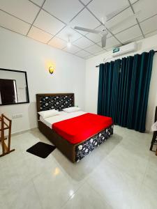 a bedroom with a bed in a room with blue curtains at G Lake Guest House in Mahiyangana