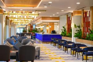 a lobby of a hotel with chairs and tables at Sunis Evren Beach Resort Hotel & Spa in Side +38 photos