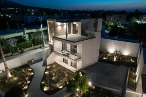 an aerial view of a house at night with lights at Avli Residences in Kos