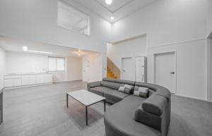 a living room with a couch and a table at Ehan Hotel in Mokpo