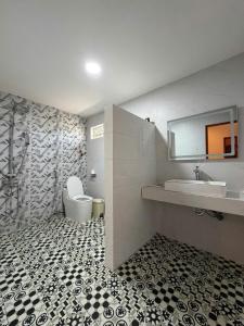 a bathroom with a sink and a toilet at PUN Retreat in Quy Nhon +32 photos