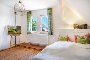 a bedroom with a bed and a window at Das Falken Nest in Eisenbach