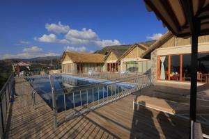 a house with a swimming pool on a deck at Mezena Resort & SPA in Lalibela