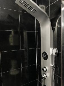 a shower with a glass door in a bathroom at Porto Nest in Senhora da Hora +20 photos
