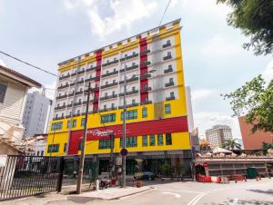 a colorful building on the corner of a street at Signature International Hotel China Town in Kuala Lumpur