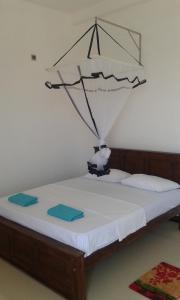 Katil atau katil-katil dalam bilik di Sunset Surfing Beach Resort