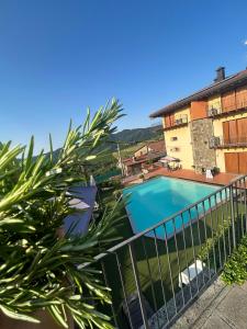 a view of a swimming pool from a balcony at La Marina Resort in Pontida