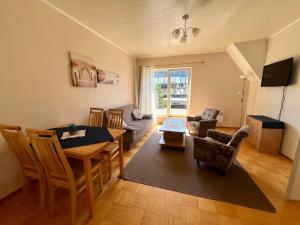 a living room with a table and a dining room at Seedri Guesthouse in Pärnu +12 photos