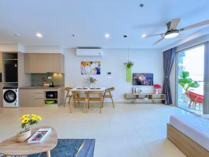 a living room with a couch and a table at The Song Boutique Apartment in Vung Tau