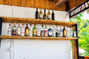 a display of bottles of alcohol on a wall at Antalya Hostel Bar & Restaurant in Kaôh Rŭng (3) +25 photos