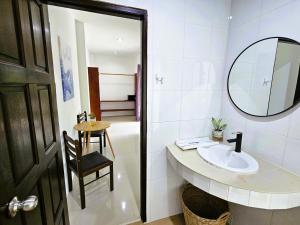 a bathroom with a sink and a mirror and a table at Suwaree Garden in Koh Samui +96 photos
