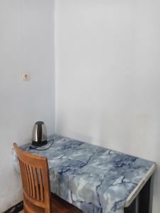 a table with a blue table cloth on it at Bale Sasak guest house in Selaparang