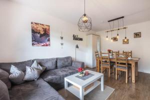 a living room with a couch and a table at Ferienwohnung Talblick in Medebach