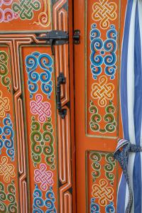a pair of doors with colorful designs on them at Countryside yurt near Tõrva in Jõgeveste