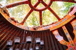 a chandelier hanging from a structure with a window at Countryside yurt near Tõrva in Jõgeveste