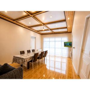 a conference room with a table and chairs in it at Qəbələn SNS RENTAL VILLA in Gabala