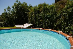 a large pool of water with trees in the background at Eleas Gi Villa in Vitalades