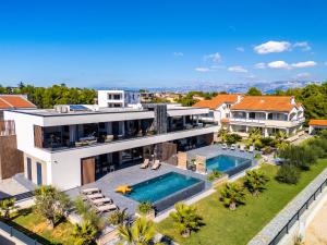 an aerial view of a house with a swimming pool at Villa Sika in Vir +64 photos