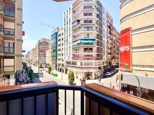 a view of a city street with tall buildings at Guest House Leo in Alicante