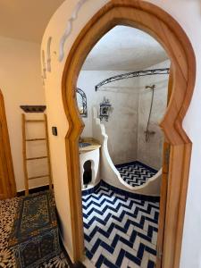 a bathroom with a shower and a bath tub at Dar Yamina Andalusi in Chefchaouen