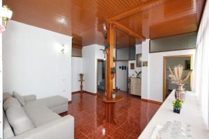 a living room with a couch and a table at Guest House Eno in Berat
