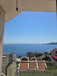 a view of the ocean from a balcony at Apartments Petar in Budva
