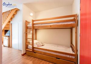 a bedroom with two bunk beds in a room at Olydea les Bottieres - Saint-Pancrace in Saint-Pancrace +7 photos