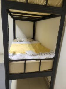 a bunk bed in a bunk bed room with a bed on top at Hostel Dubrovnik Center Free Parking in Dubrovnik +18 photos