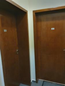 two wooden doors are next to each other at Room 2 in Gotse Delchev