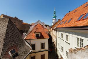 an overhead view of roofs of buildings in a city at APLEND CITY Paul Inn in Bratislava