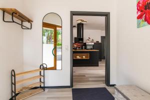 a door leading into a kitchen with a mirror at Ferienwohnung Hopf in Bad Liebenstein