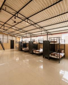 a large room with several bunk beds in it at SLV Comforts in Chikmagalūr