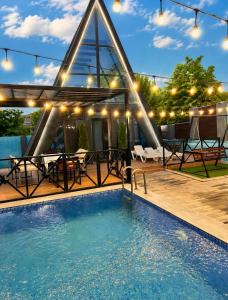 a house with a swimming pool and a patio at Aframezing Gabala in Gabala