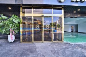 a building with a glass door with a guitar outside at Ehan Hotel in Mokpo