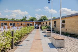 a walkway in front of a brick building at Danhostel Tønder in Tønder