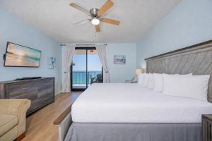 a bedroom with a bed and a ceiling fan at Phoenix X 1110 in Orange Beach +47 photos