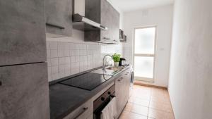 a kitchen with a sink and a counter top at Casa Olmedina in Olmedo