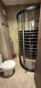 a bathroom with a shower and a toilet in it at MitProt Panorama Bay 2 Luks Studio 170 in Sveti Vlas +11 photos