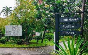 a sign for a club house pool bar and fitness at Sunday Sea Two Pool Villa Pattaya in Jomtien Beach