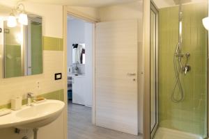 a bathroom with a sink and a shower at Meublé Leonetti in Palinuro +68 photos