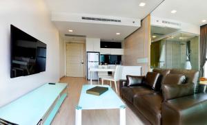 a living room with a couch and a table at Lux SL Luxury Style of Life 2 in Jomtien Beach