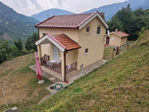 a small house on top of a hill at Villa Natalija in Andrijevica
