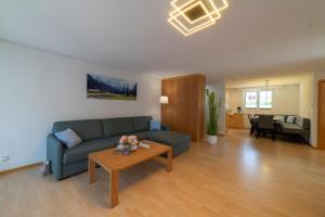 a living room with a couch and a table at Bruno in Unterwasser