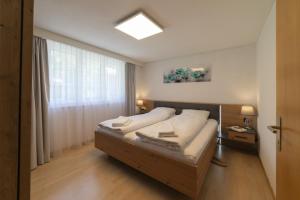 a bedroom with a bed with a skylight at Bruno in Unterwasser