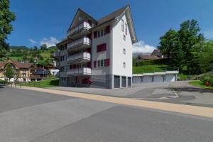 a large white building on the side of a street at Bruno in Unterwasser