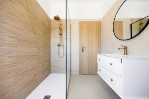 a bathroom with a sink and a mirror at Seafront Villa in Kornati Private Terrace and Direct Beach Access in Kornati +48 photos